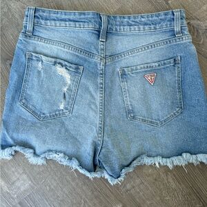 Guess high waisted denim shorts size 29 • cut side panels